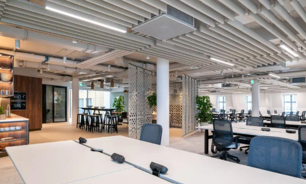 Open-plan office with exposed ceiling services and ceiling cassette terminals